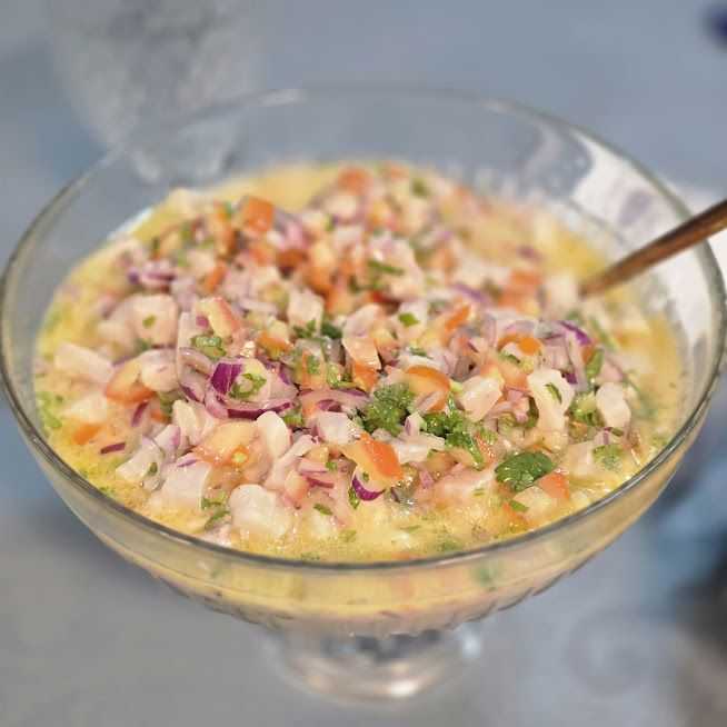 Uma tigela de comida com uma colher dentro-Pousada-Recanto-do-Chef