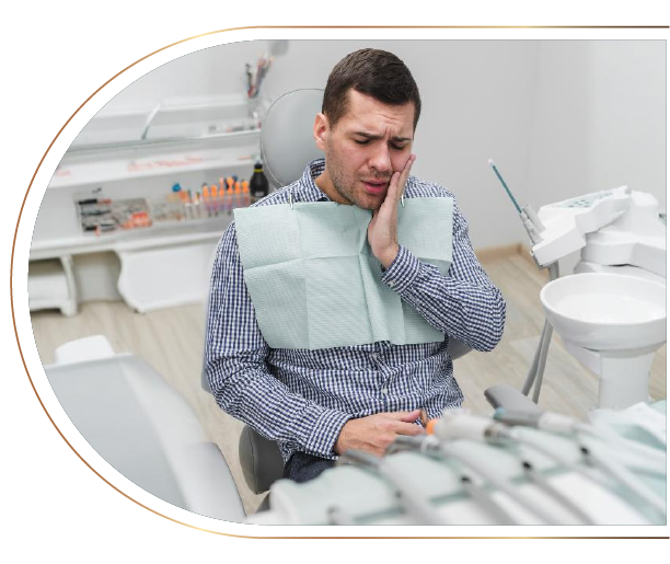 A man is sitting in a dental chair with a toothache.