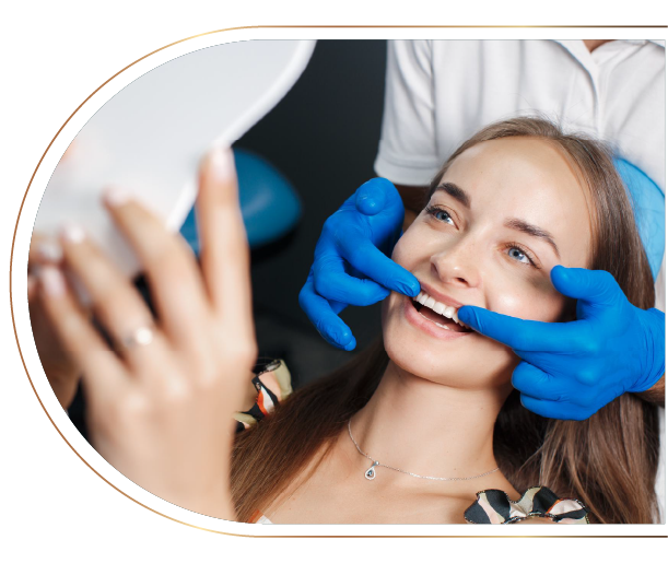 A woman is getting her teeth whitened by a dentist