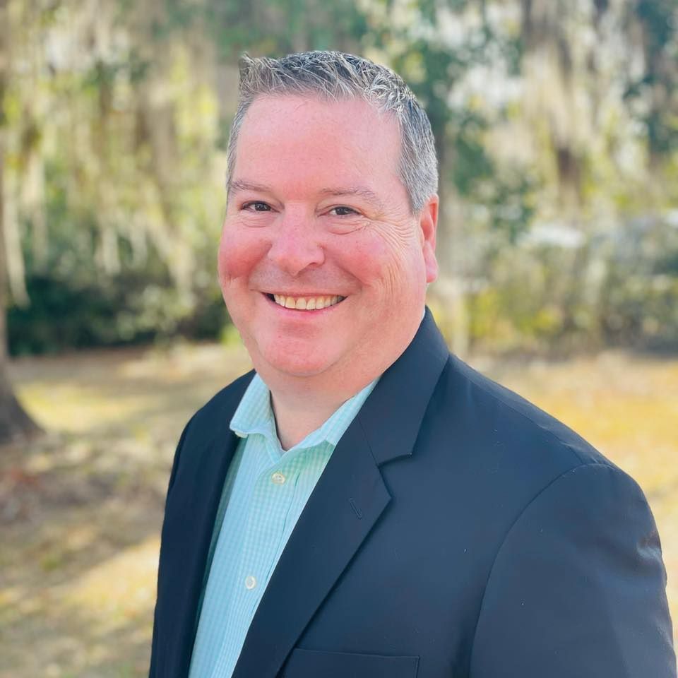 Two beagle dogs are sitting in the back of a vehicle.