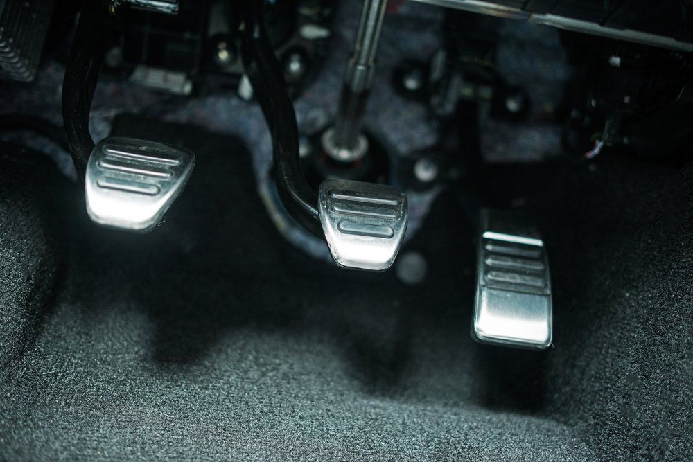 Car's Interior View of Three Metal Pedals — Motorhead Garage in Tweed Heads, QLD