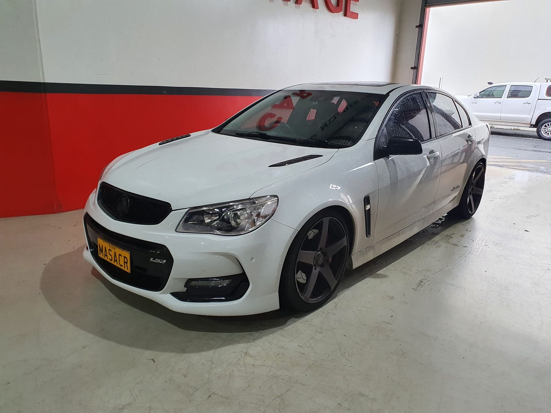 Blue and White Vintage Car Parked in a Garage — Motorhead Garage in Tweed Heads, QLD