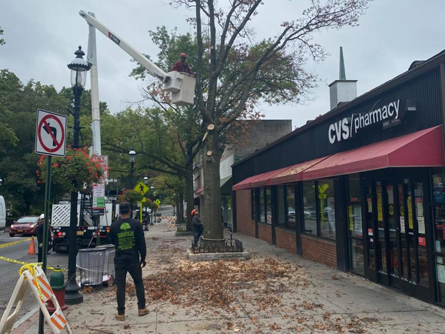 A man is standing in front of a cvs pharmacy