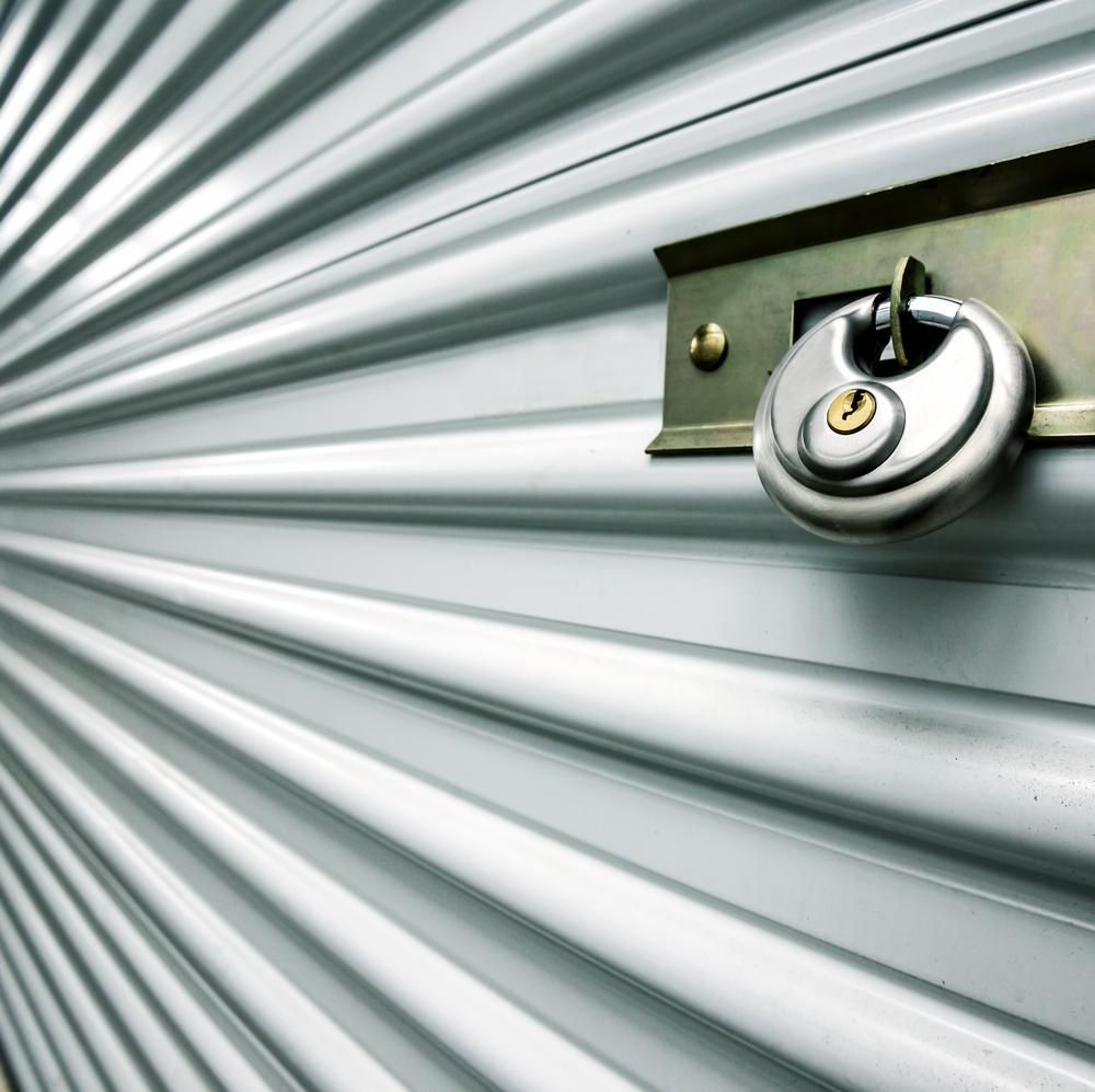 A Metal Door With A Padlock On It — Raymond Terrace Public Storage In Thornton, NSW