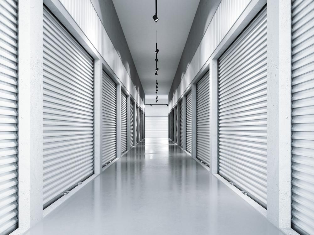 A Long Hallway With A Lot Of Shutters On The Doors — Raymond Terrace Public Storage In Raymond Terrace, NSW