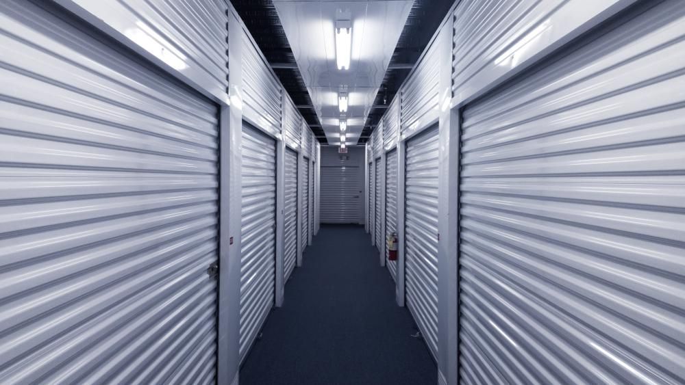 A Long Hallway Filled With Rows Of Empty Storage Units — Raymond Terrace Public Storage In Fern Bay, NSW
