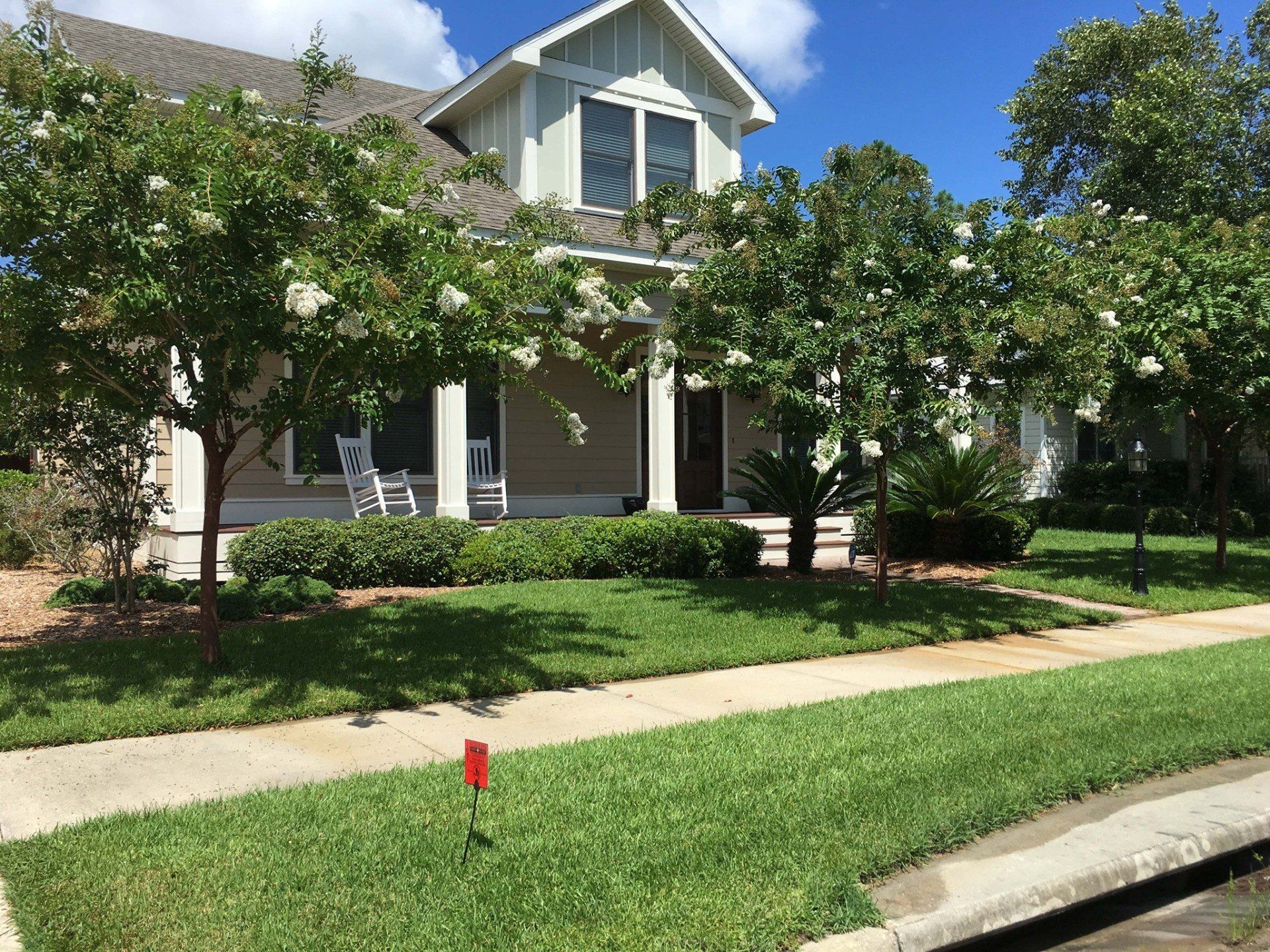 House with trees - Panama City, FL - Noles Scapes