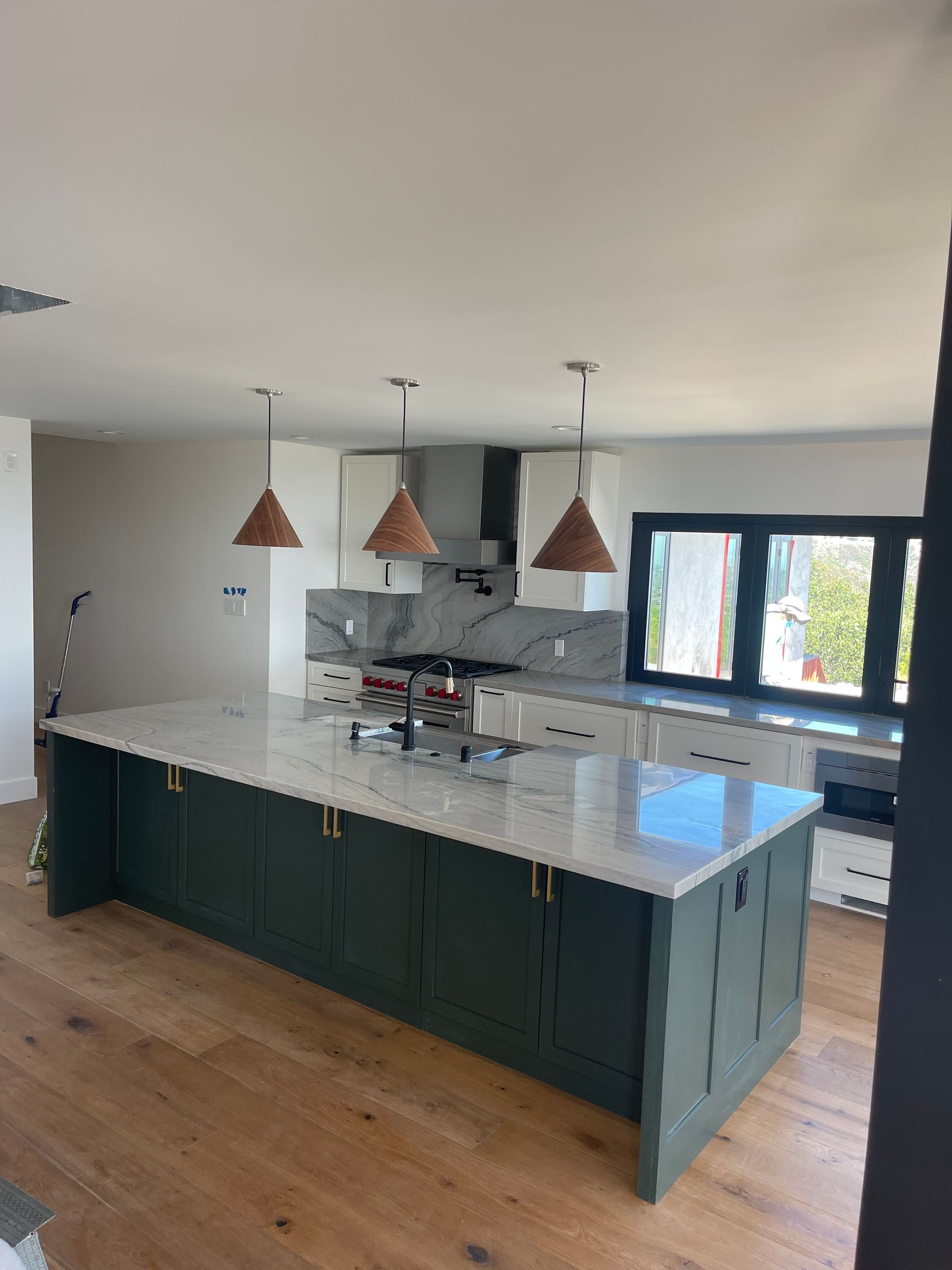 A kitchen with a large island in the middle of the room.
