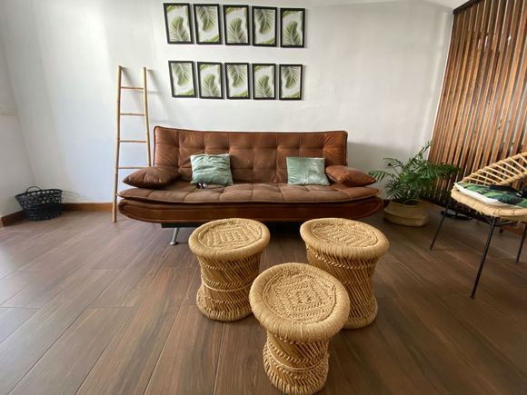 A close up of a wooden floor next to a door in a room.