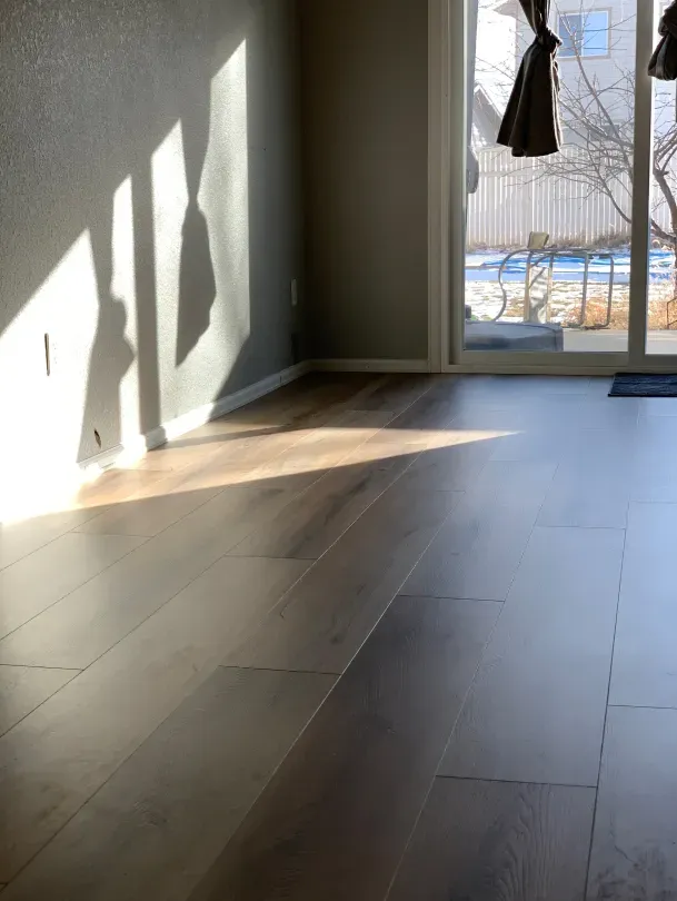 A living room with hardwood floors and a sliding glass door