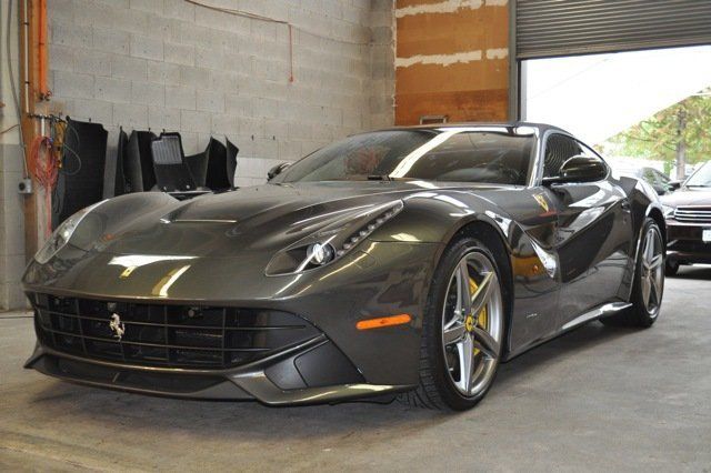 A ferrari sports car is parked in a garage