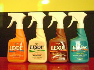 Four bottles of lexol are lined up in a row