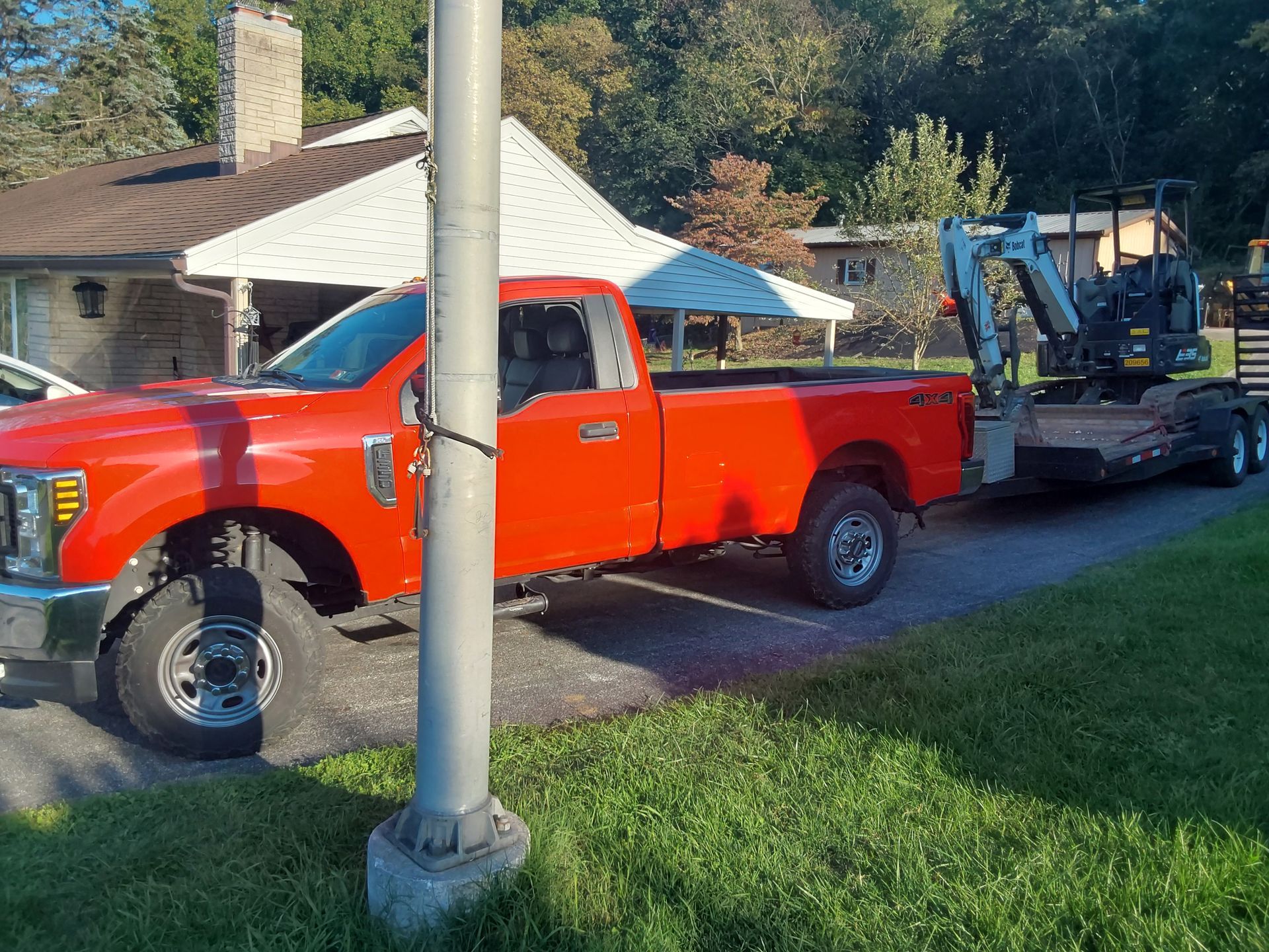 a red truck is parked in front of a house