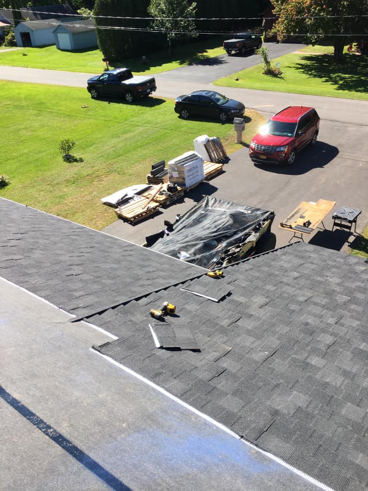 A car is parked on the roof of a house.