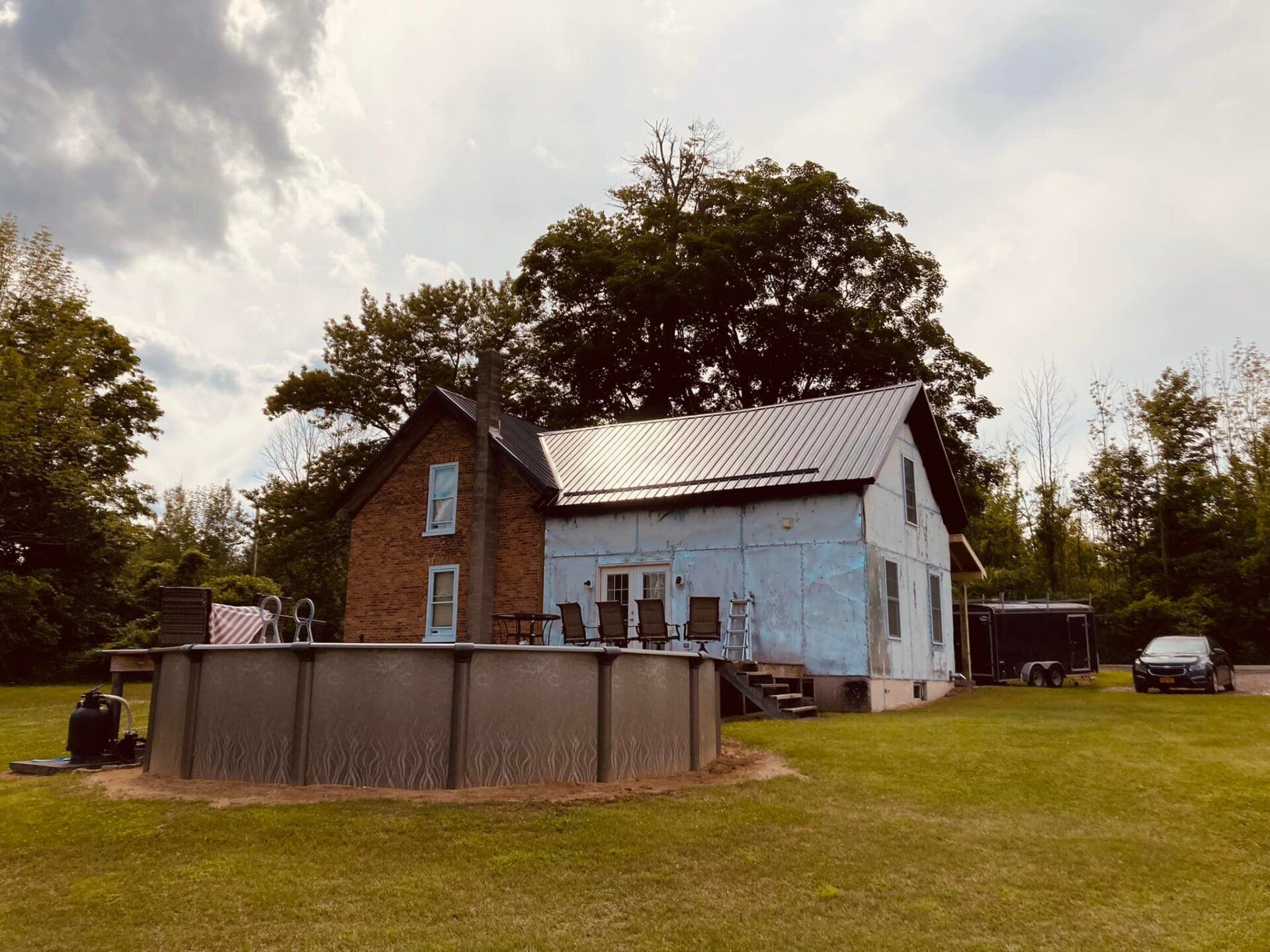 A house with a pool in front of it