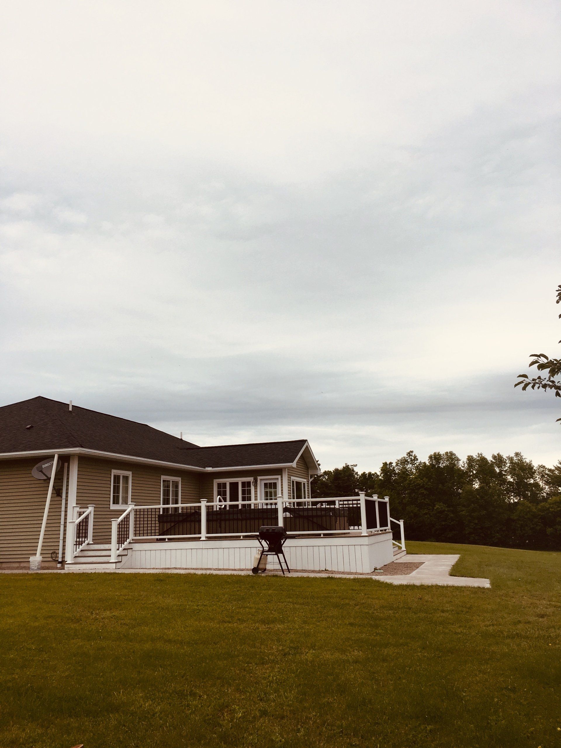 A house with a large deck in the backyard