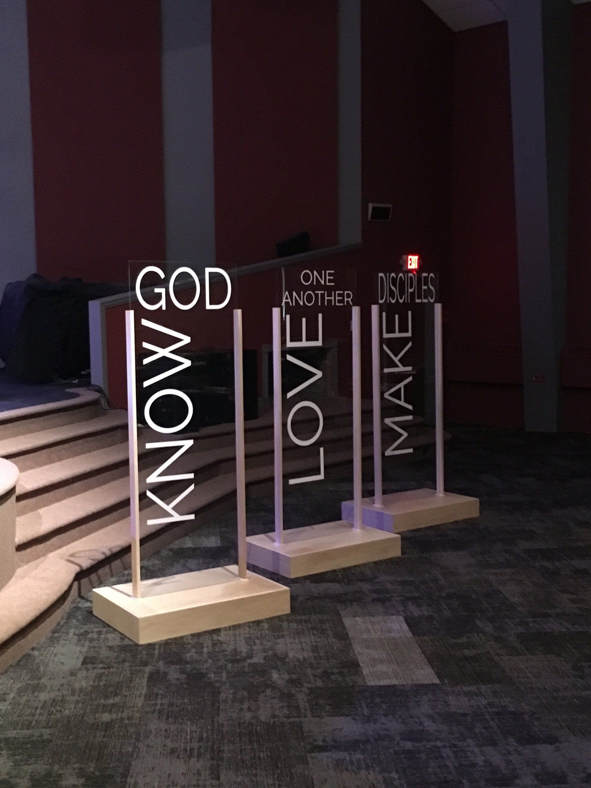 A row of signs that say know god love and make