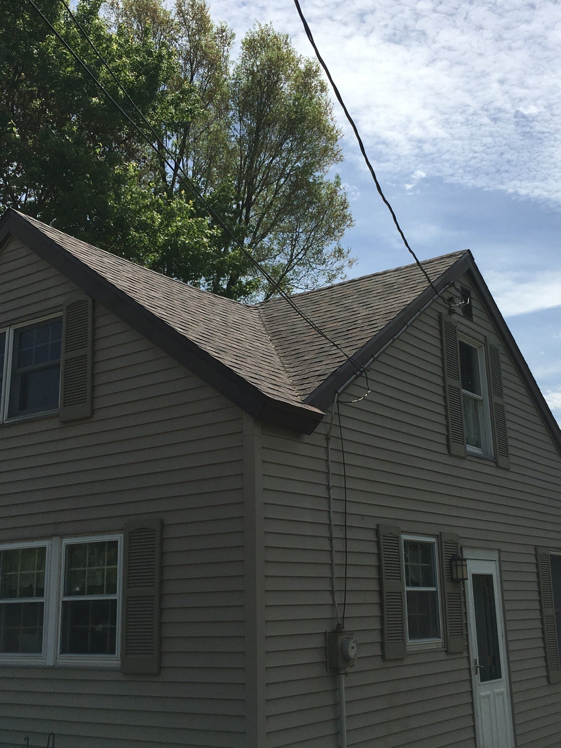 A house with a roof that is covered in shingles