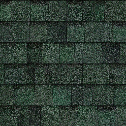 A close up of a row of green shingles on a roof.