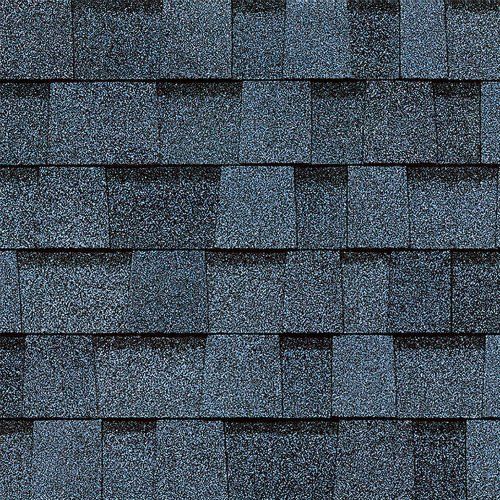 A close up of a row of blue shingles on a roof.