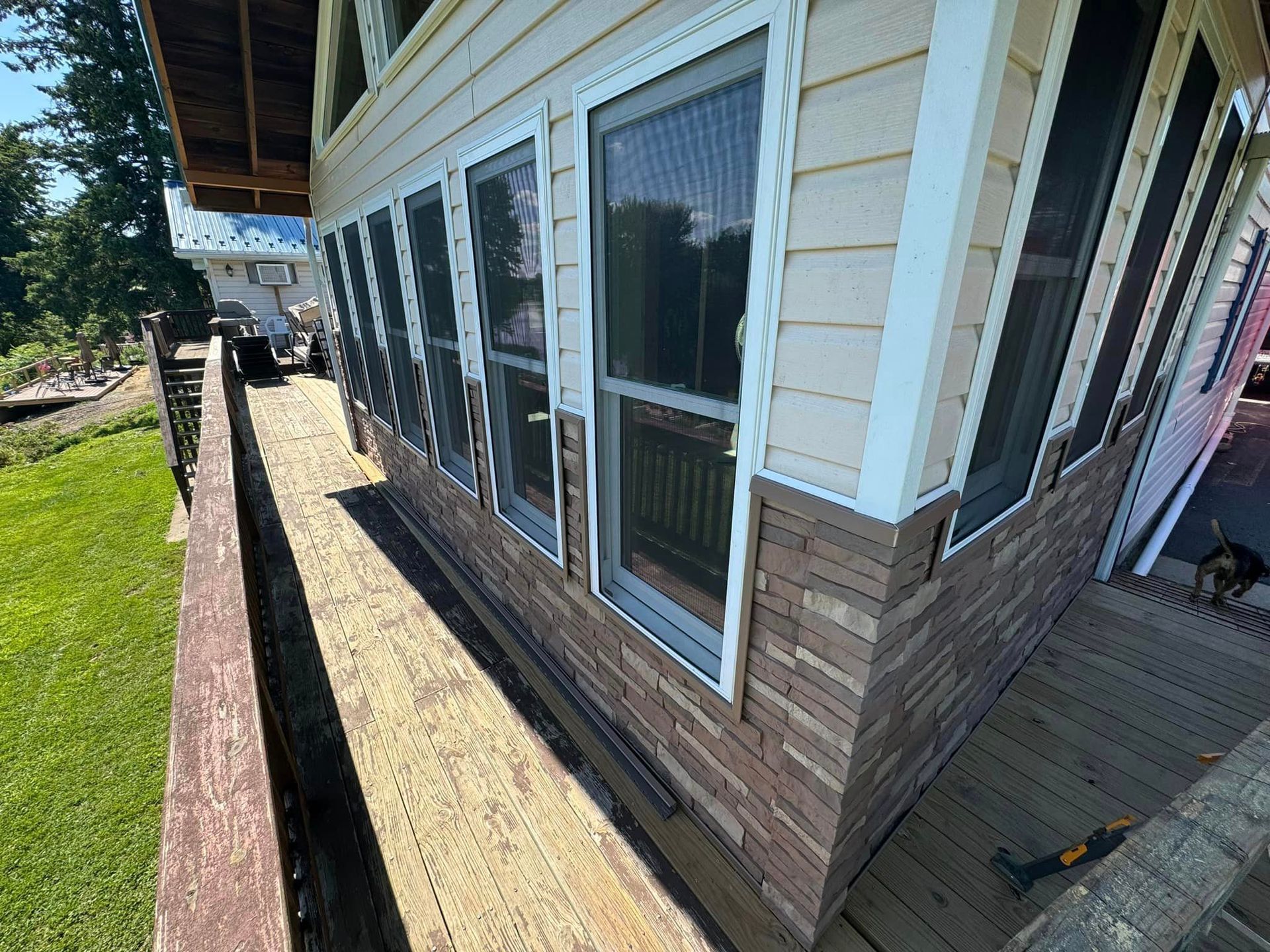 A house with a lot of windows is being remodeled.