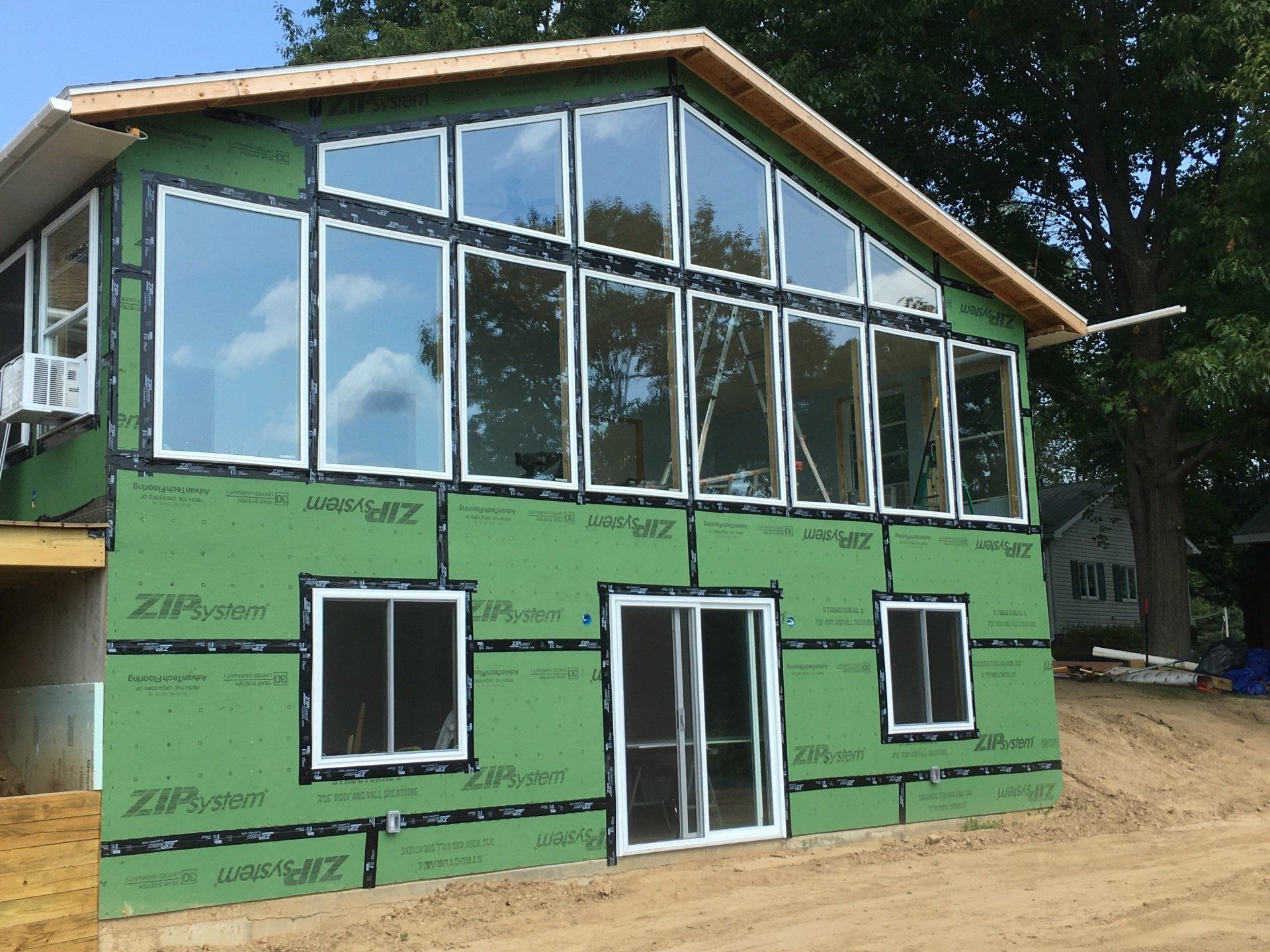 A house with a lot of windows is being built