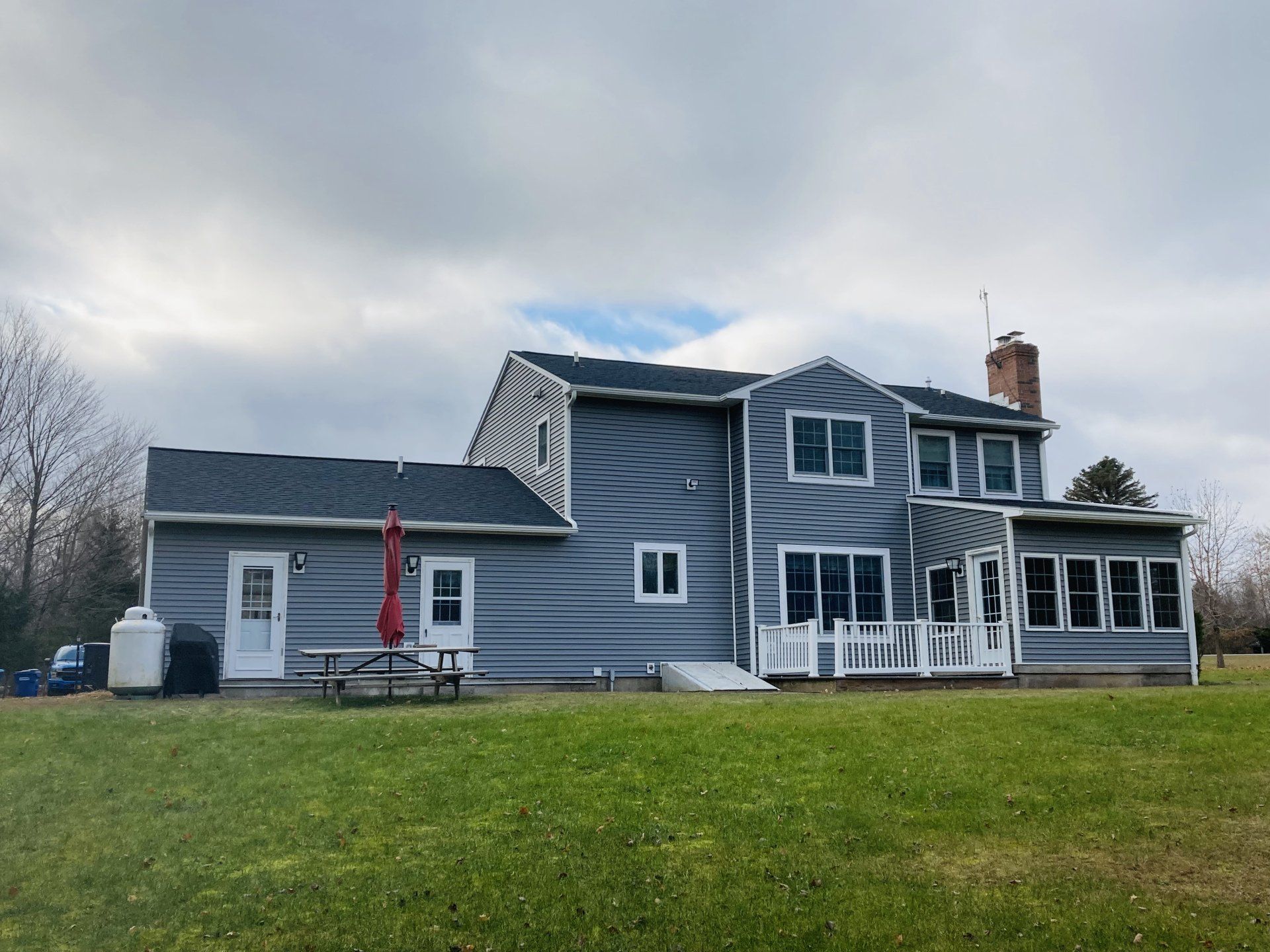 A large house with a large lawn in front of it