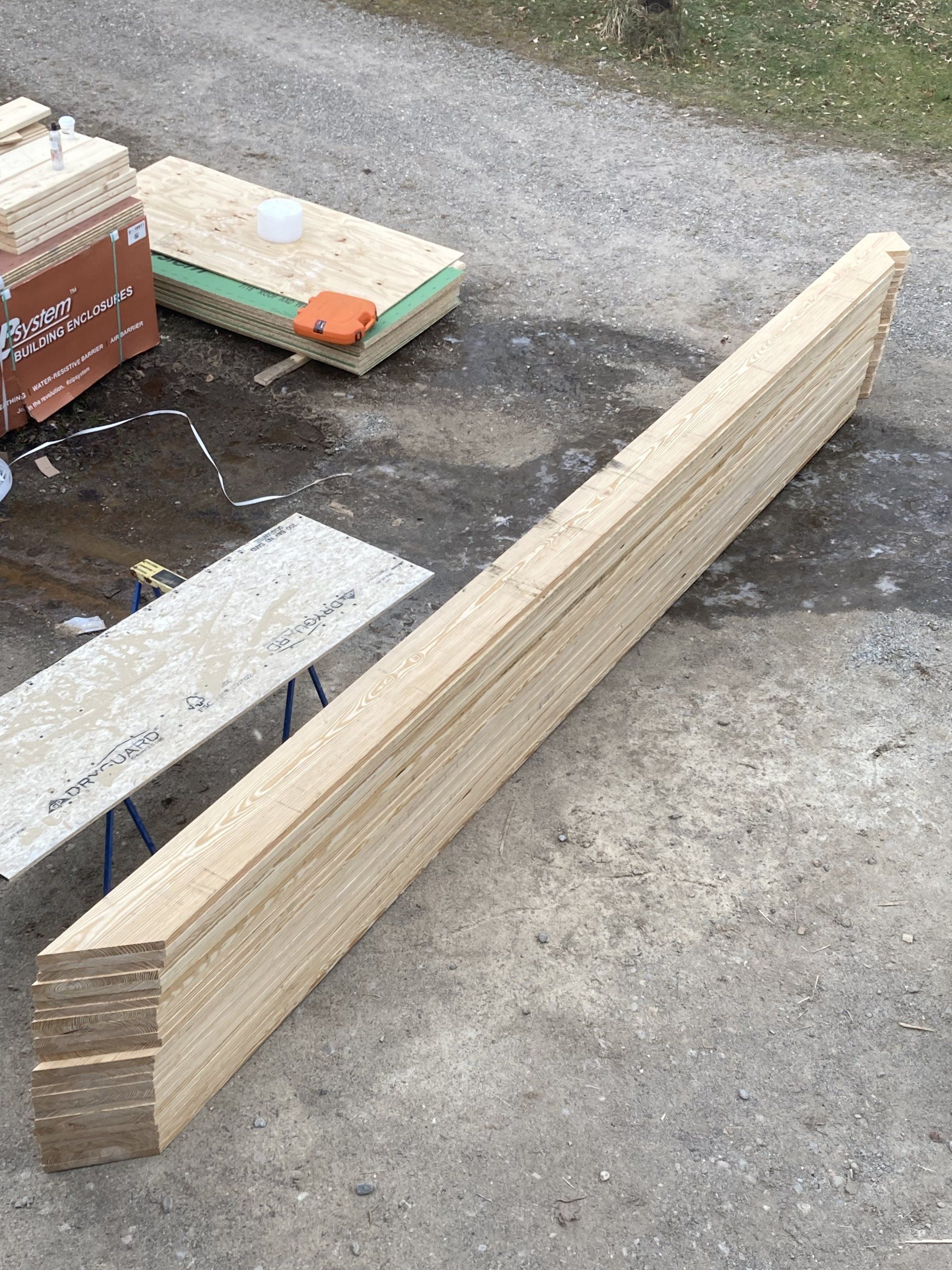 A large piece of wood is laying on the ground