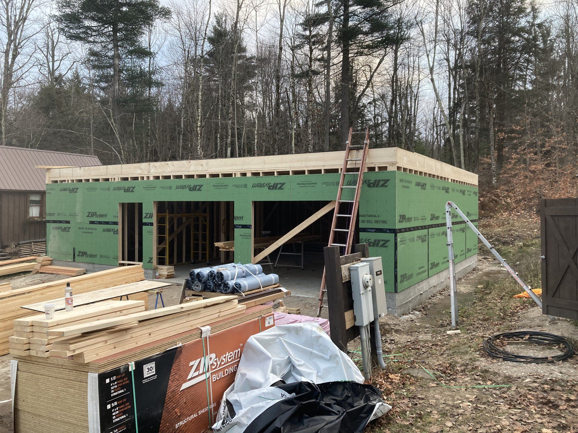 A house is being built in the middle of a forest.