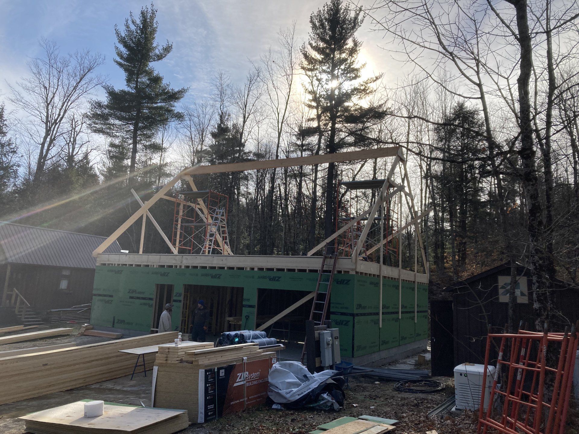A house is being built in the middle of a forest.