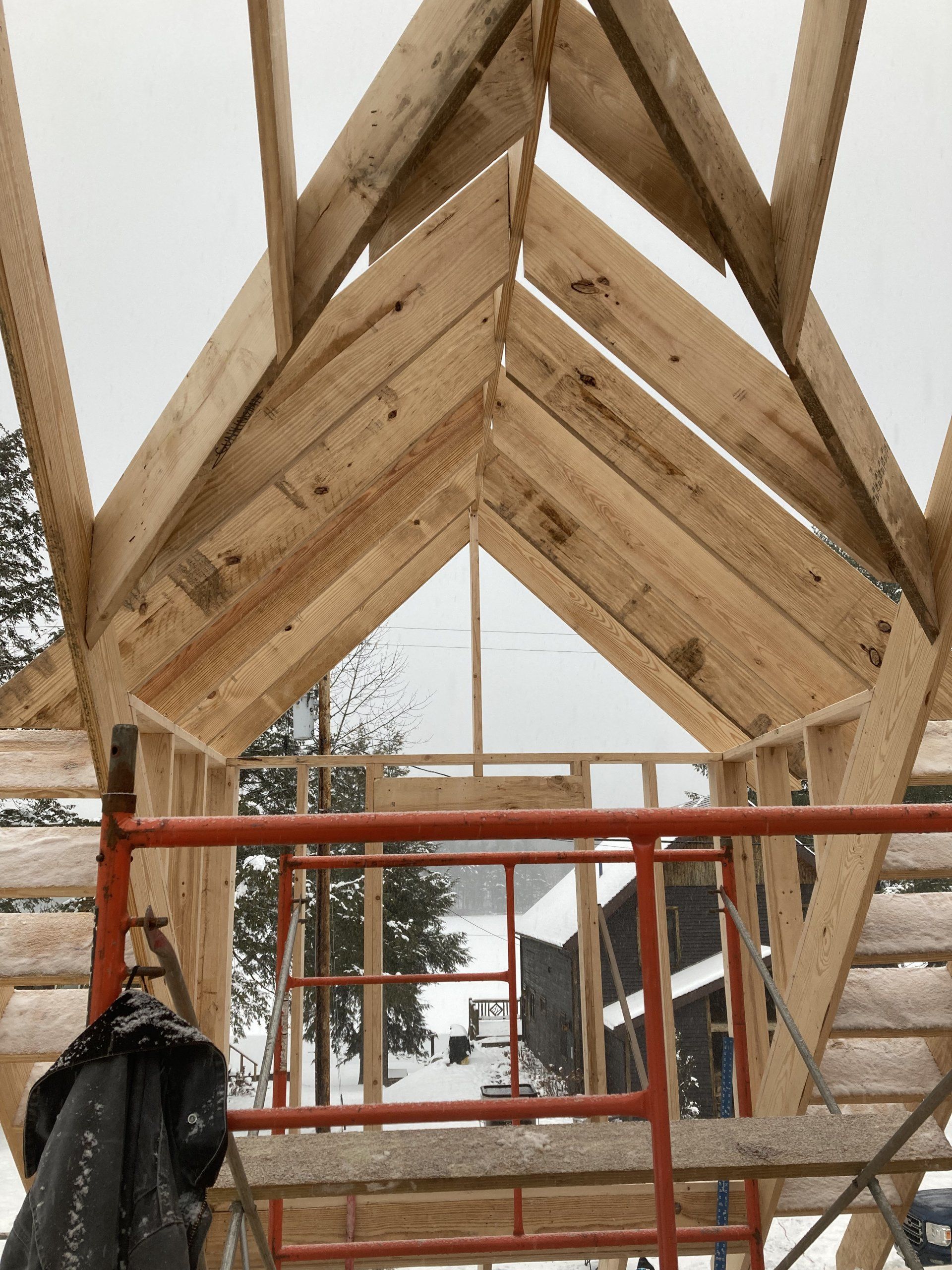A wooden structure is being built in the snow