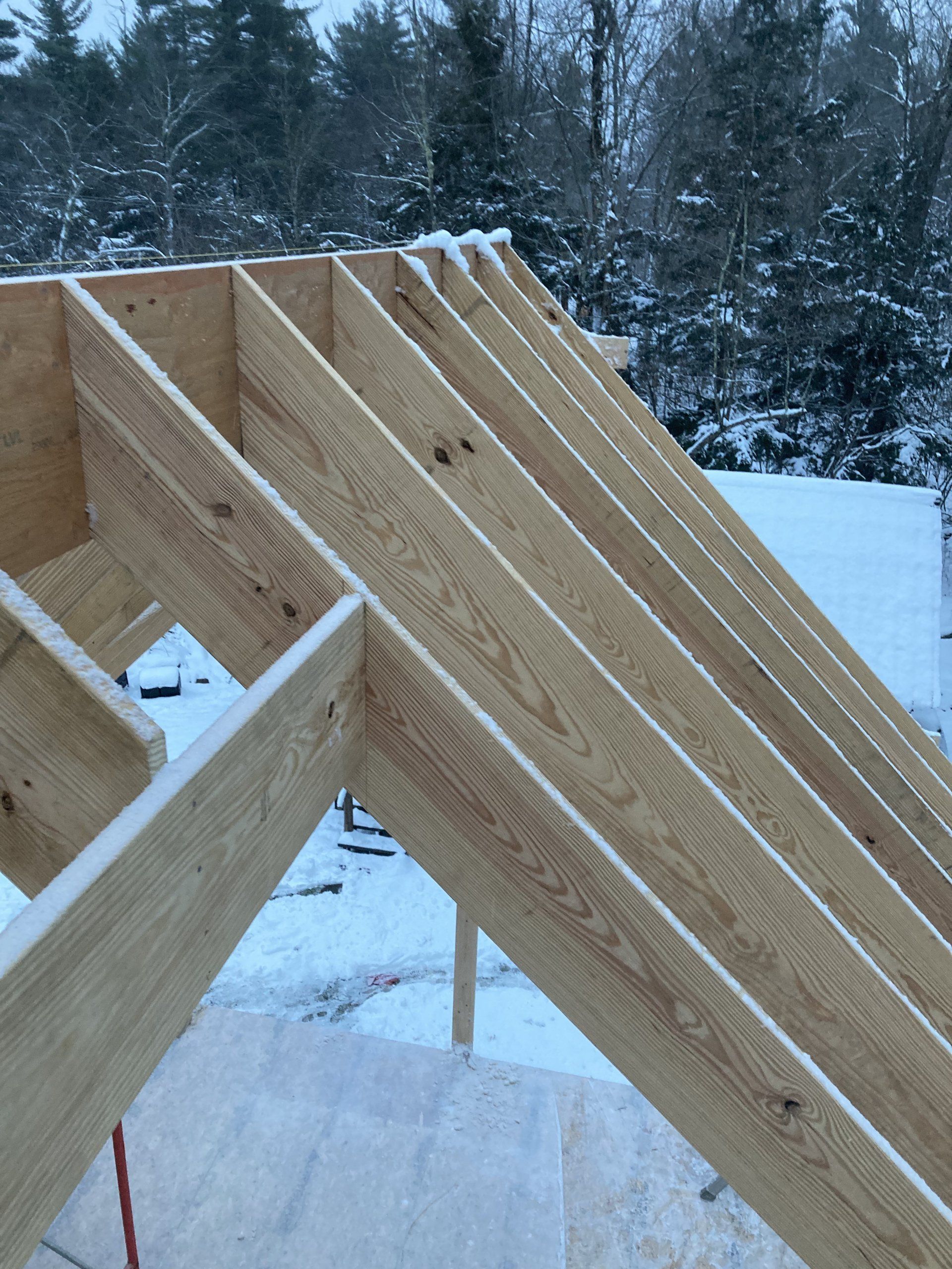 A wooden structure is being built in the snow