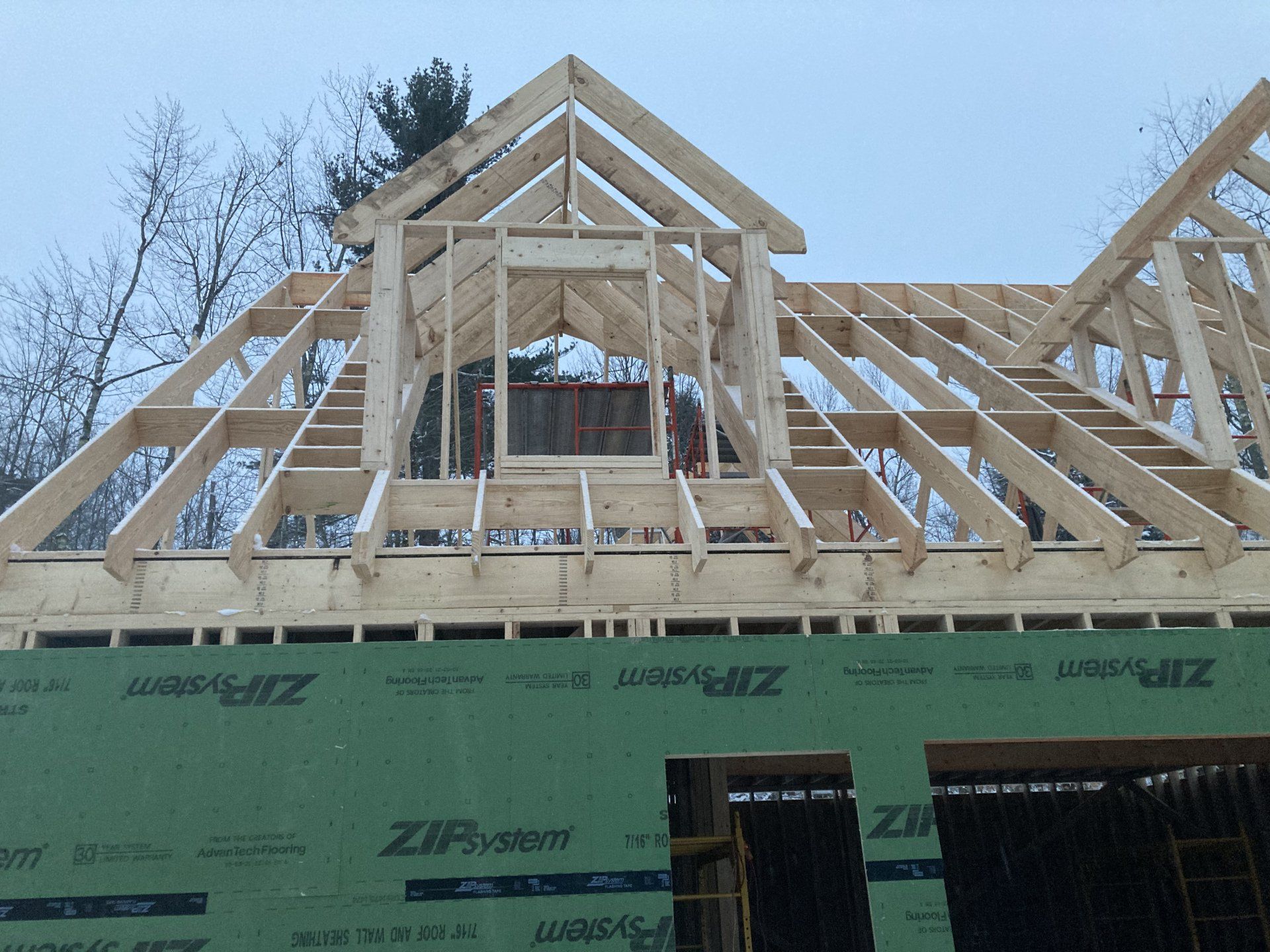 The roof of a house under construction is covered with zipsystem