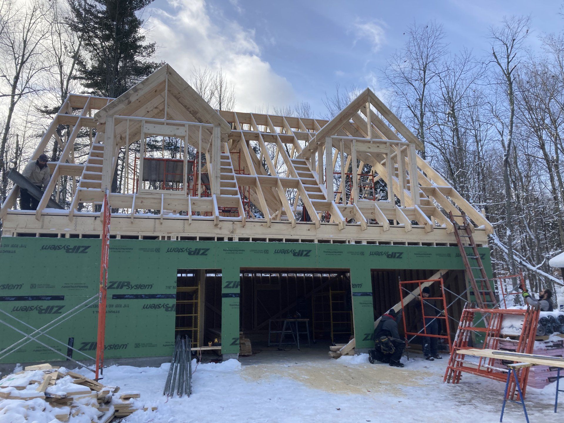 A house is being built in the snow.