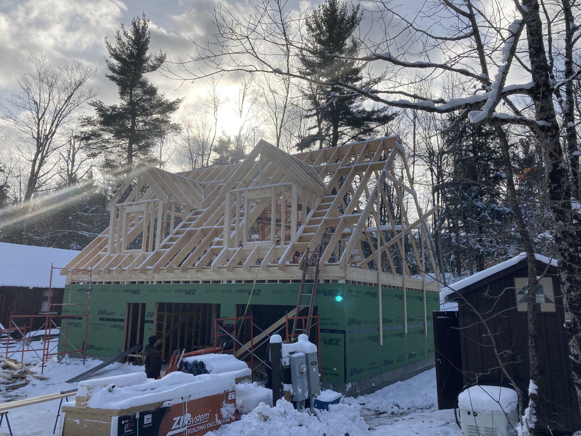 A house is being built in the snow.