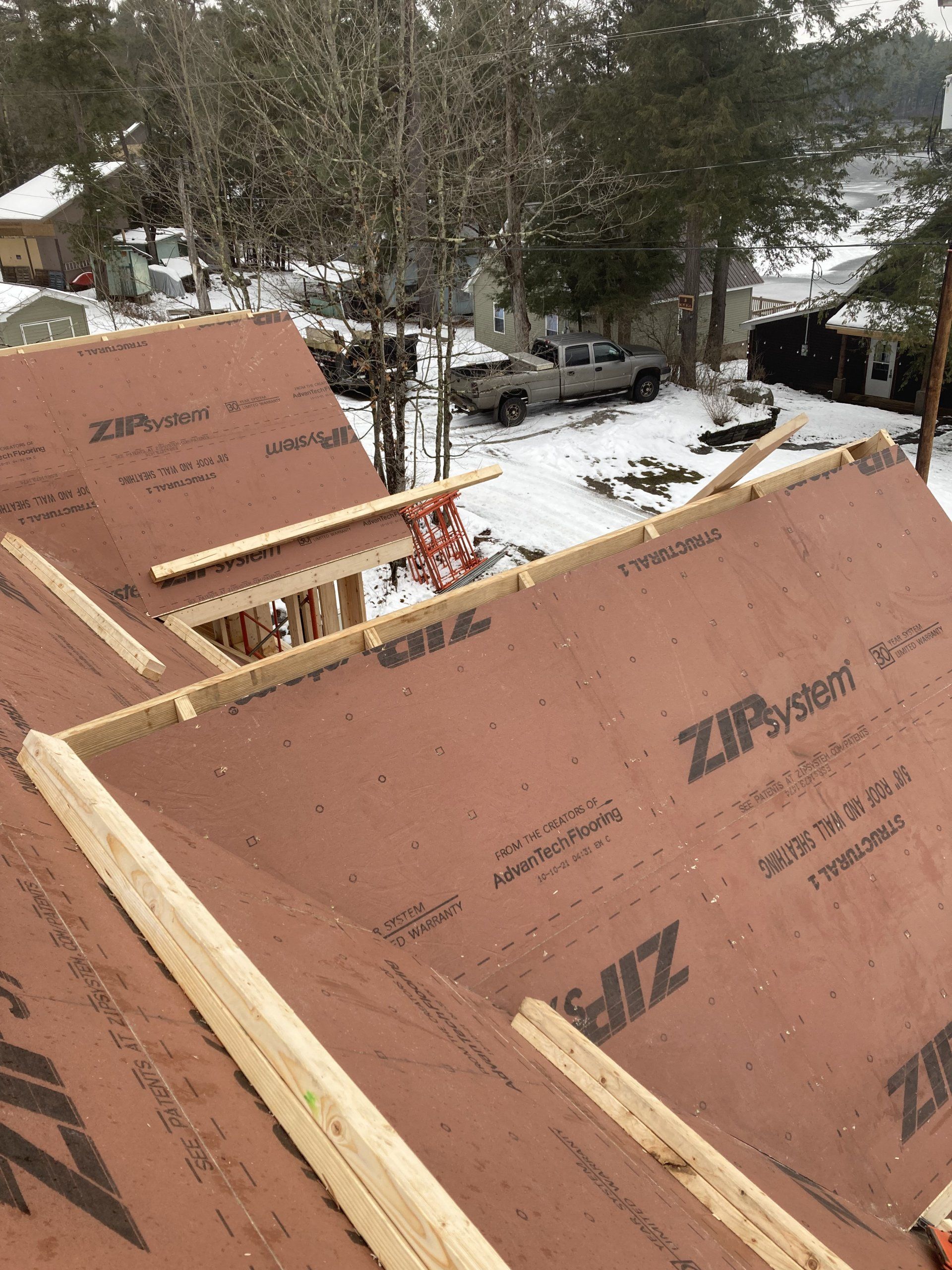 The roof of a house is being built with zip roofing.