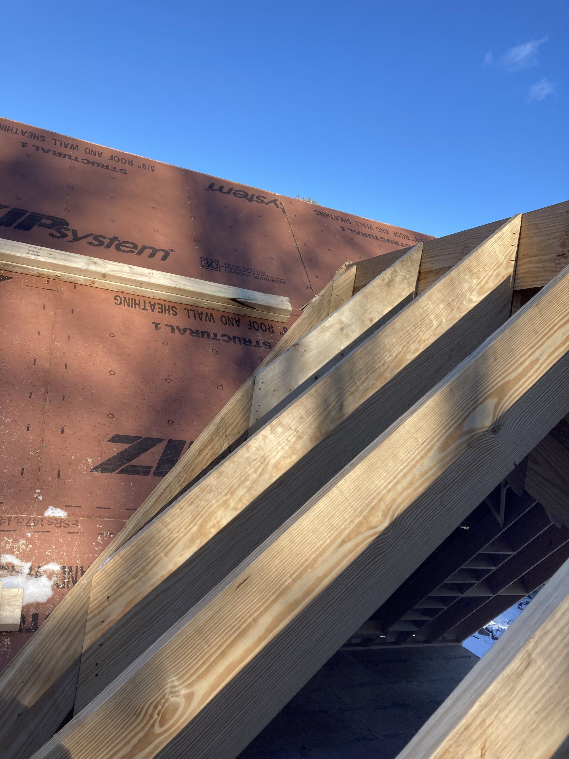 A roof is being built with a system z1 roofing material