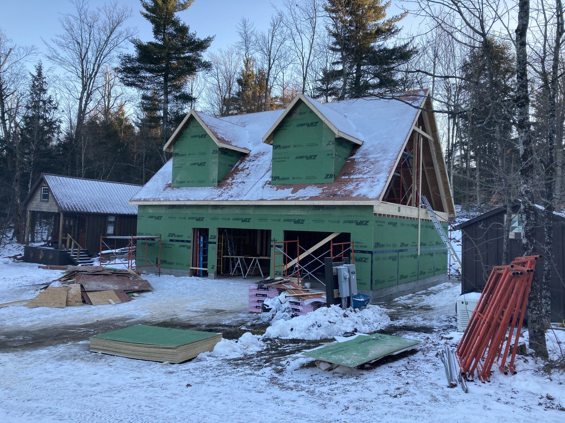 A house that is being built in the snow