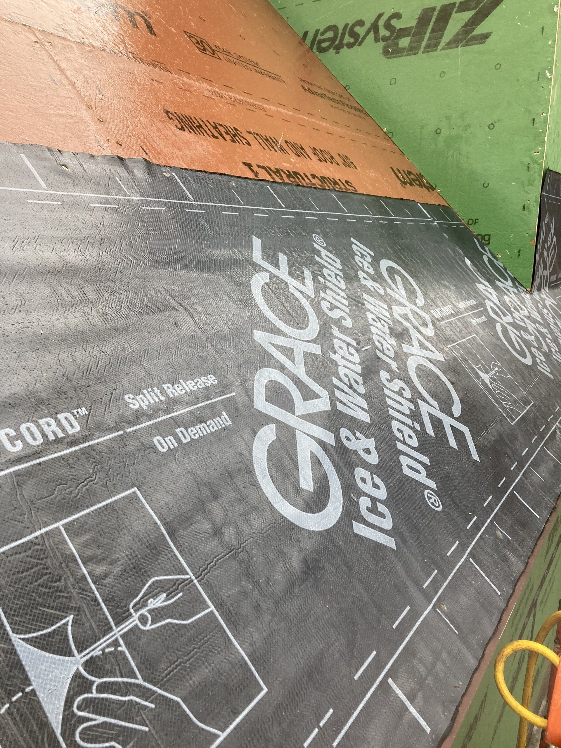 A grace ice and water shield is being installed on a roof.
