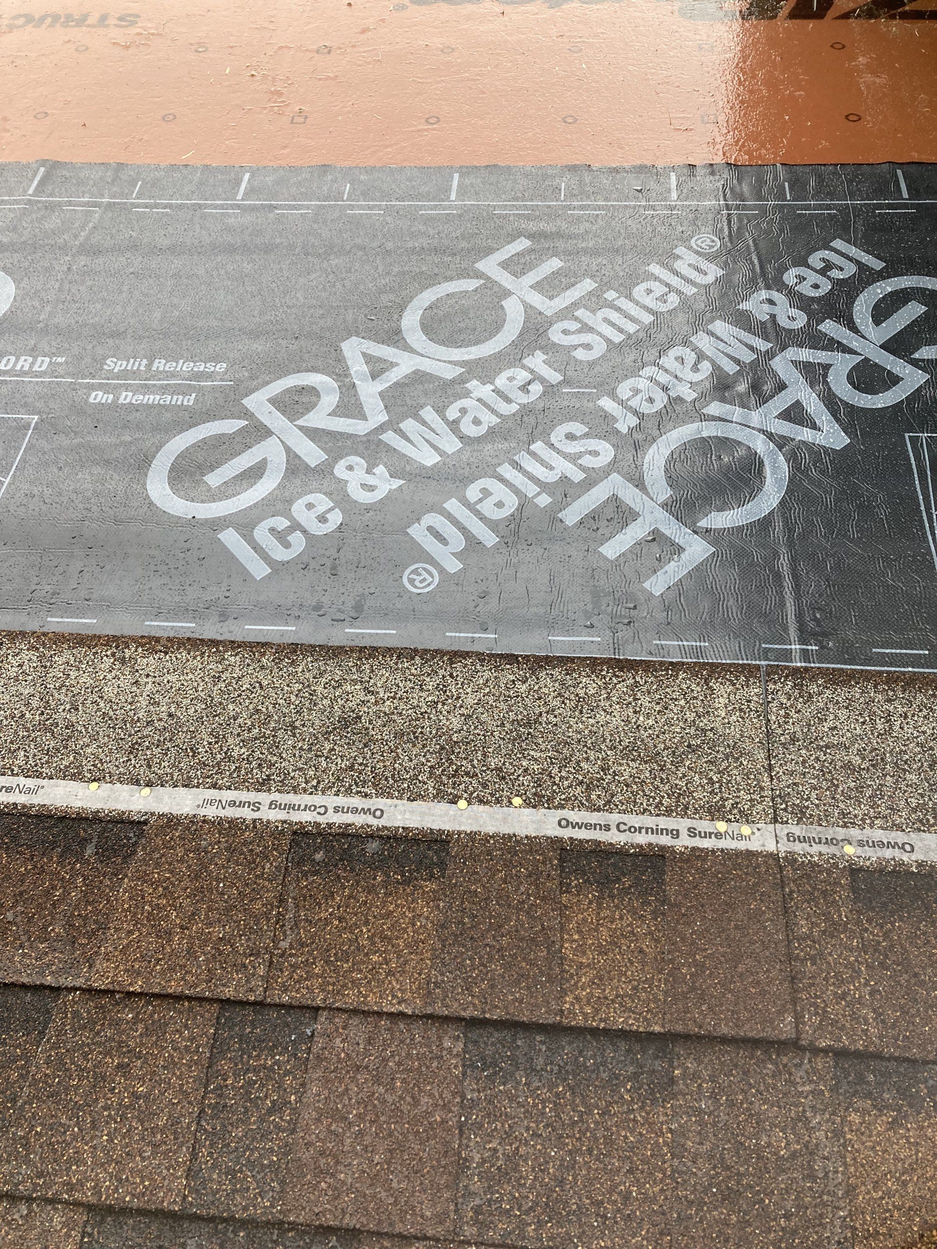 A piece of ice and water shield is sitting on top of a staircase.