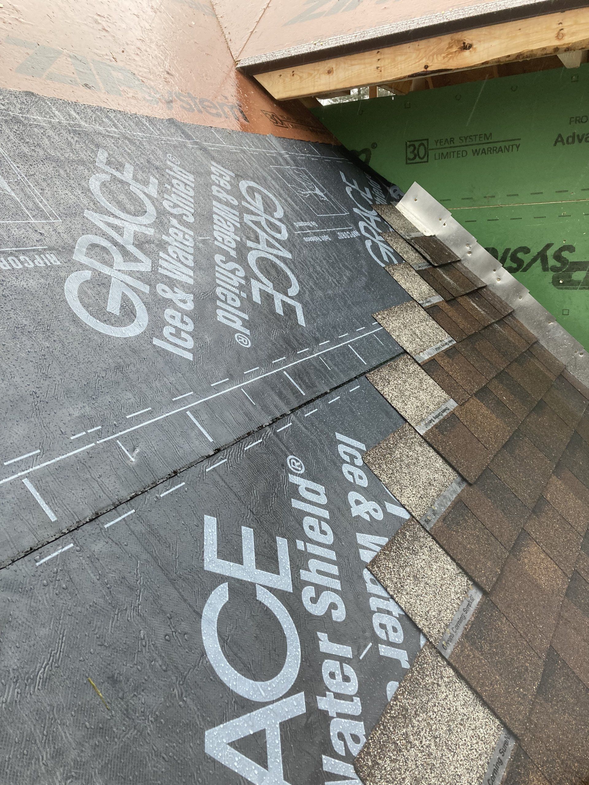 A close up of a piece of roofing material on a roof.