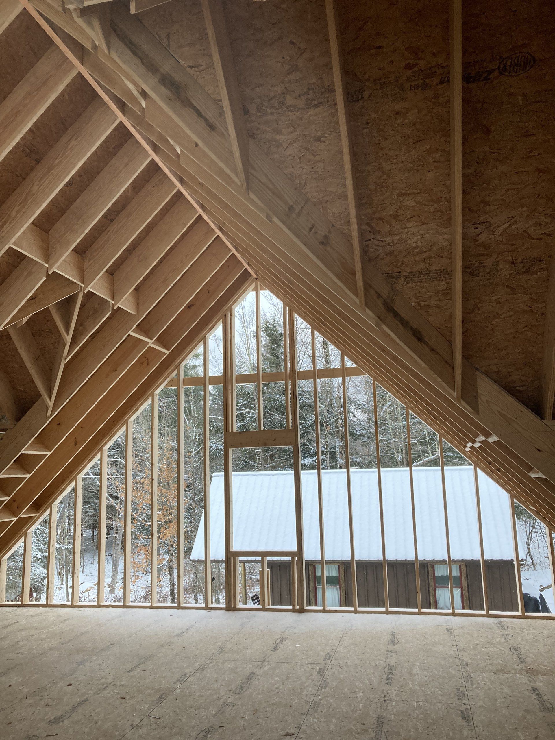 The inside of a building under construction with a large window
