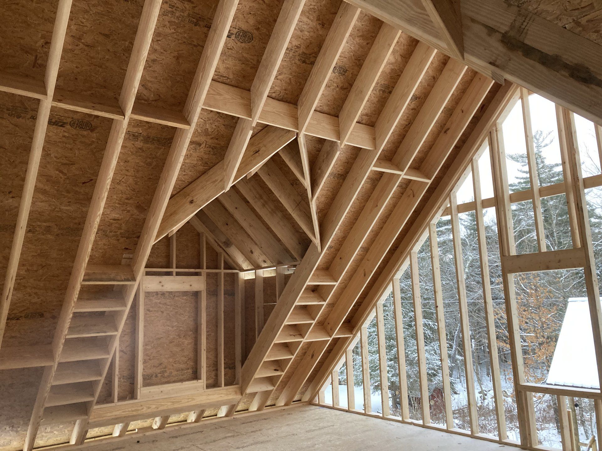The inside of a house under construction with a lot of windows