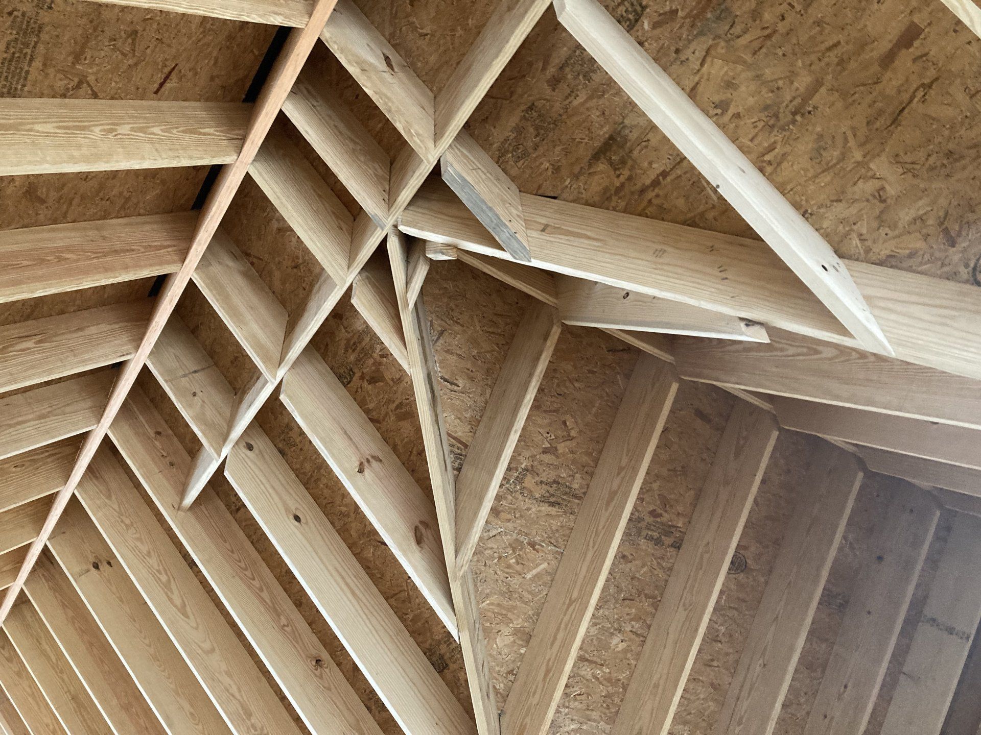 A close up of a wooden structure with a vaulted ceiling