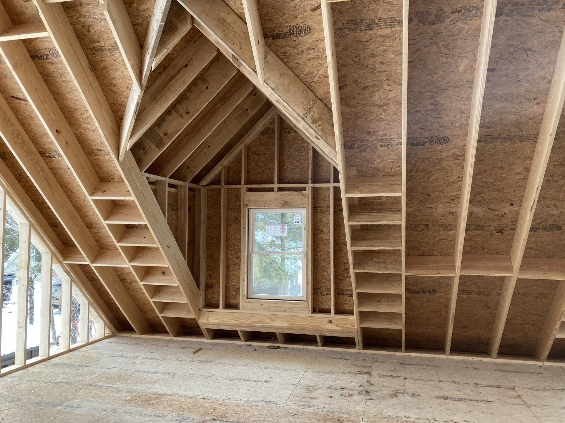 A room under construction with a window in the corner