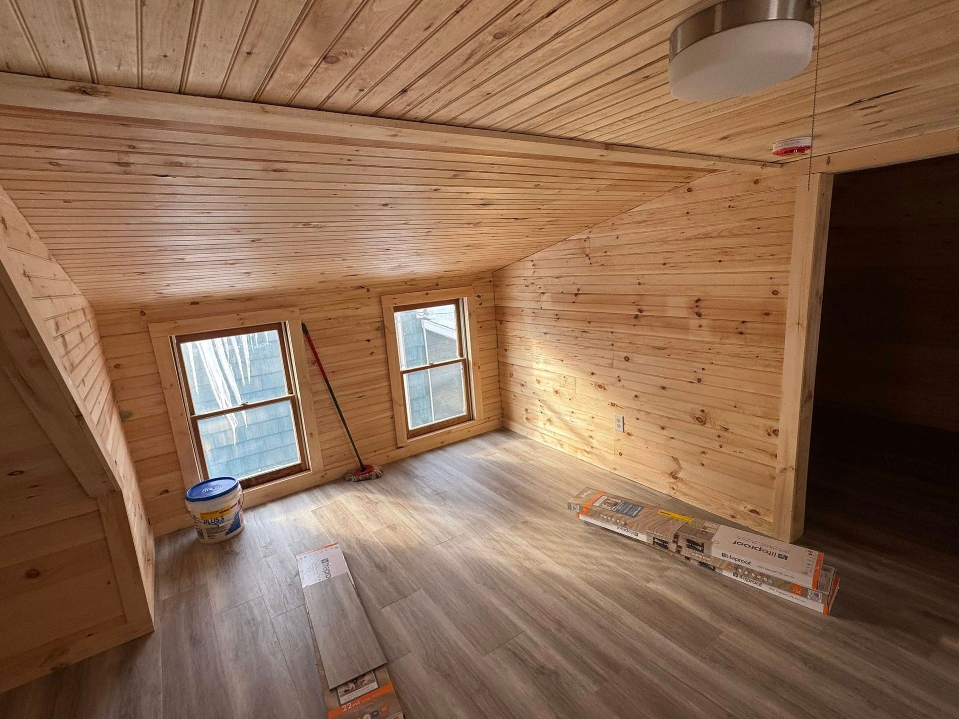 A wooden frame is being built around a hole in the ground.