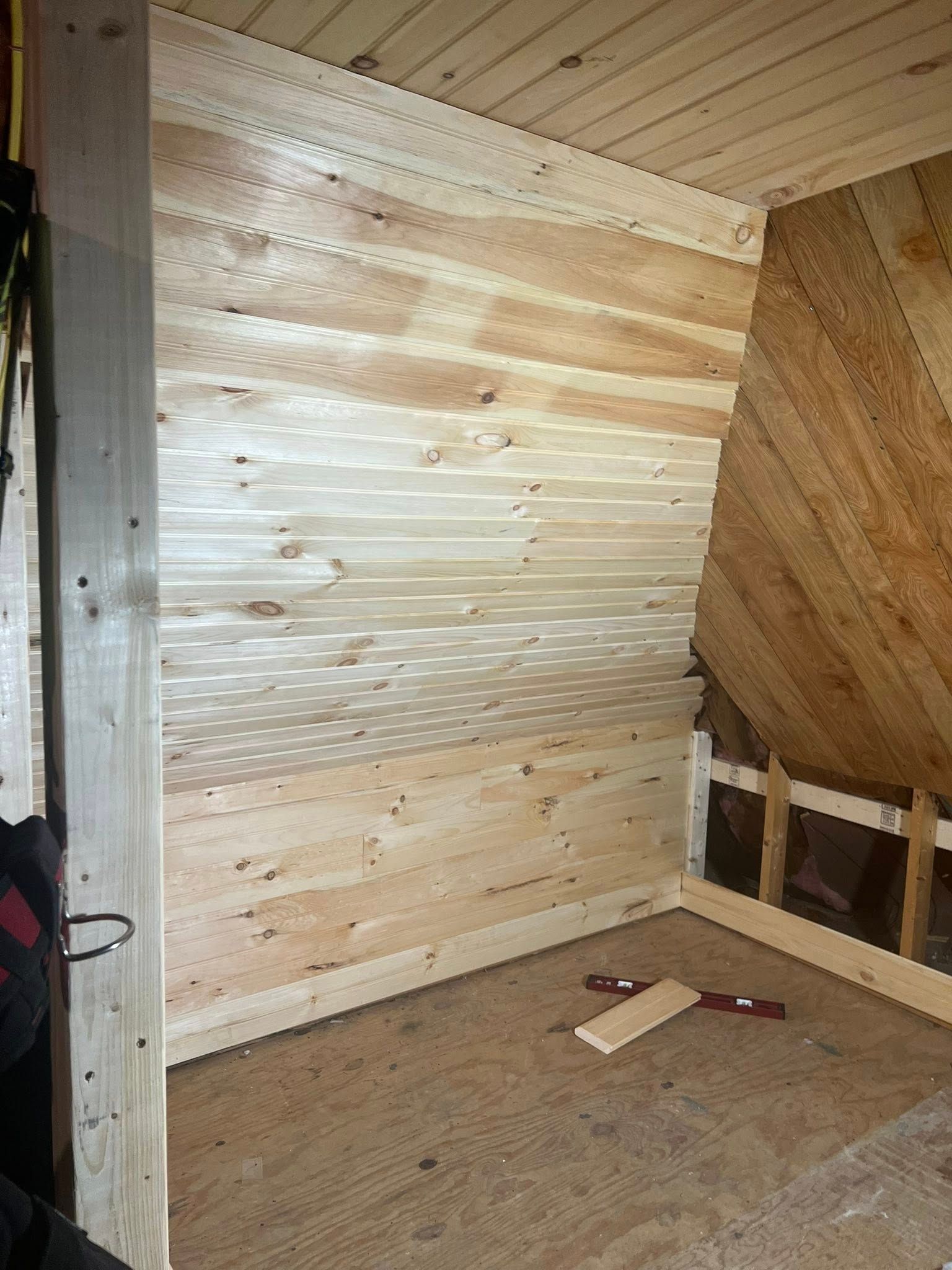 A house is being built with a circular saw in front of it.
