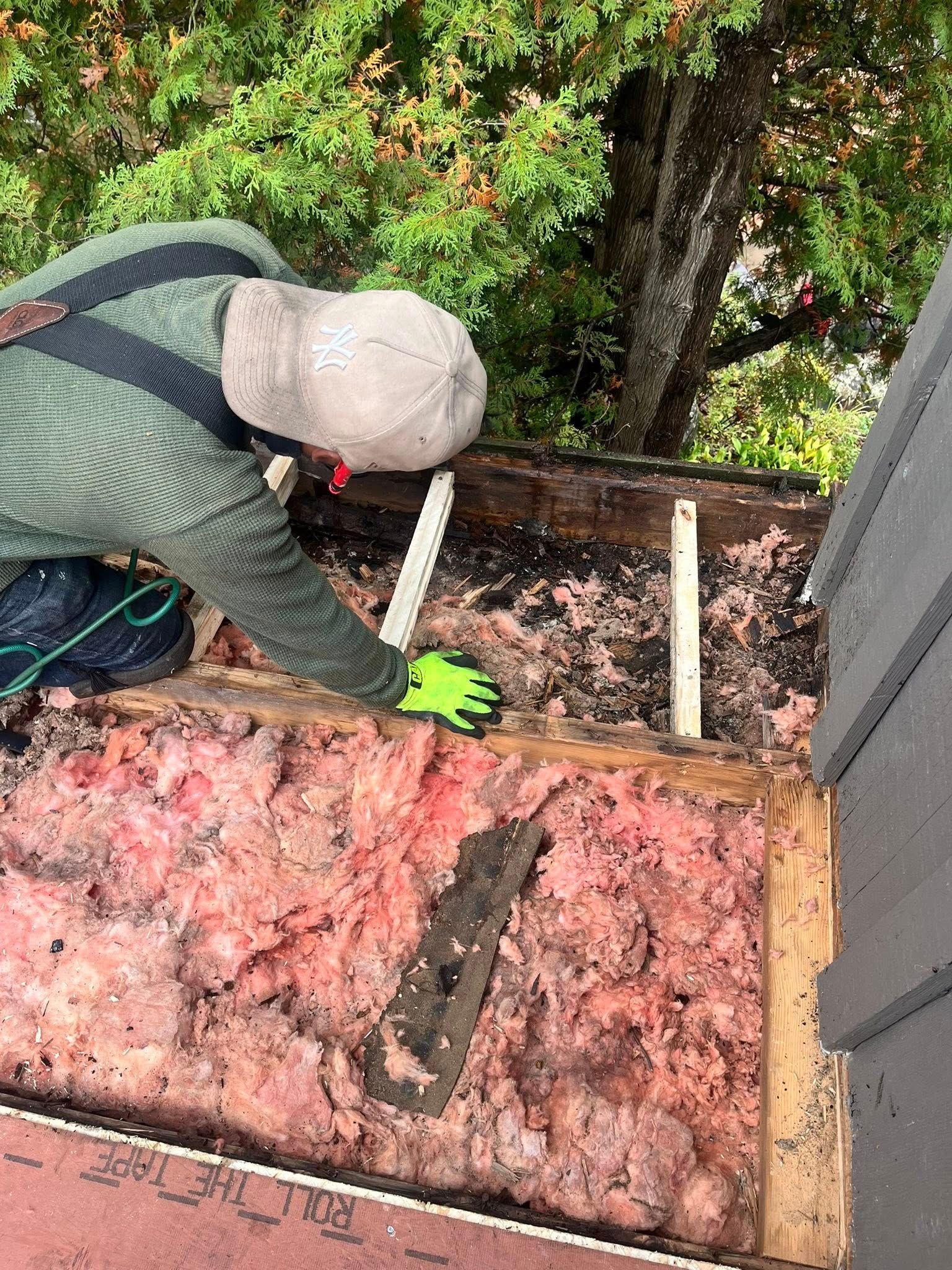 A brick house with a porch and a green door.