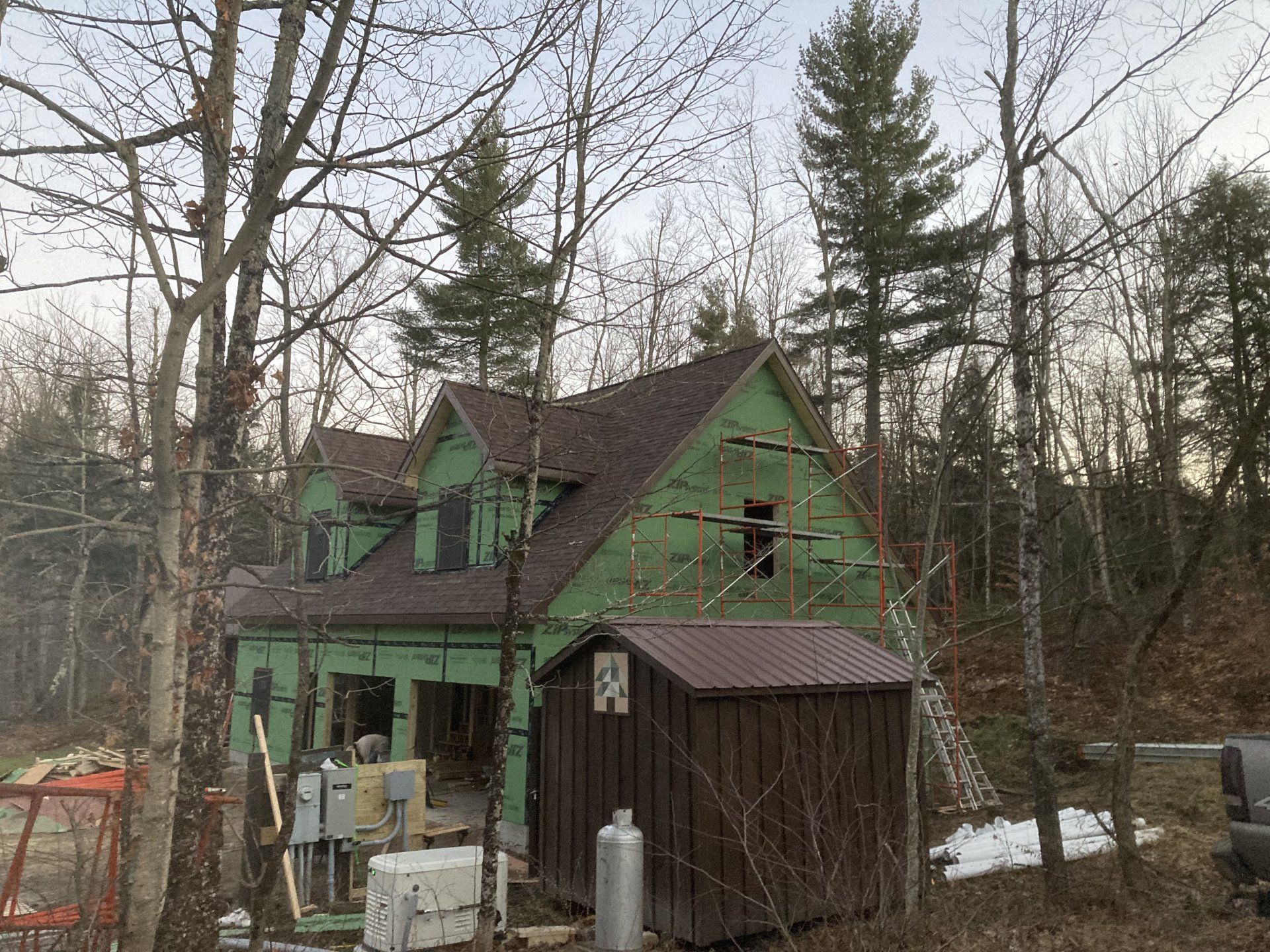 A house is being built in the middle of a forest.