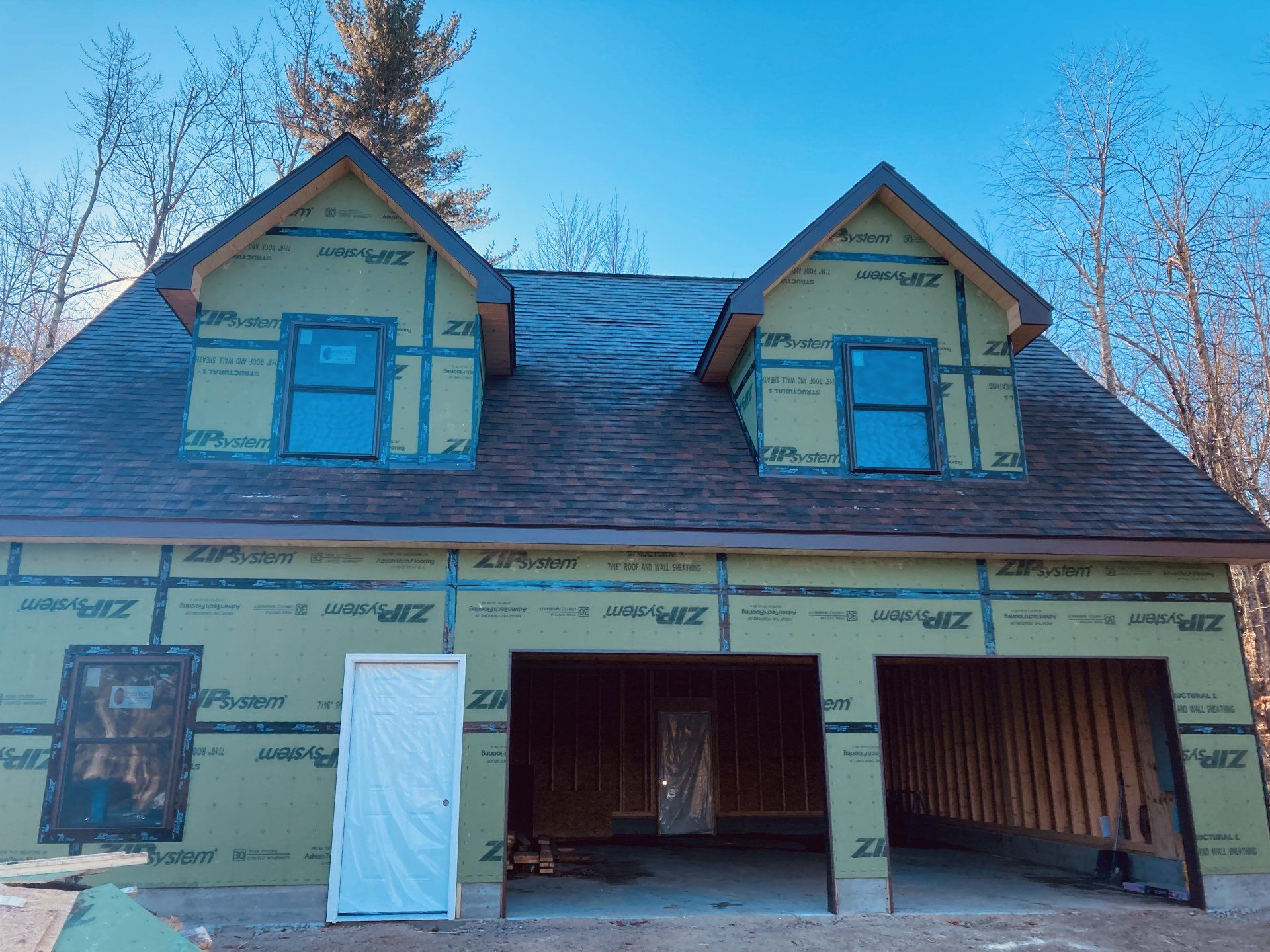 A house that is being built with a roof and windows